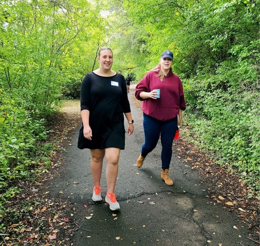 Friends on the wooded pond path